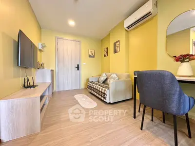 Charming living room with modern decor and cozy seating in a stylish apartment.