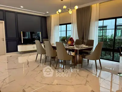 Elegant dining room with marble floors and modern lighting, perfect for entertaining guests.