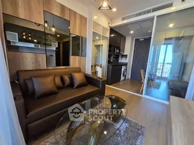 Modern living room with stylish decor and open kitchen layout in a contemporary apartment.