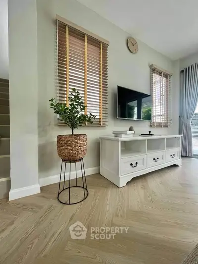 Stylish living room with modern decor and wooden flooring