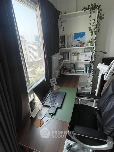 Modern study room with desk, laptop, and city view from window