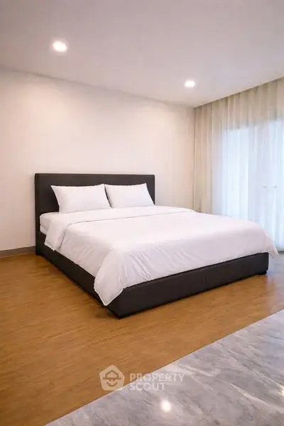 Spacious modern bedroom with elegant design and natural light