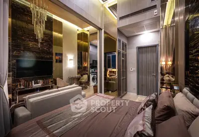Luxurious modern bedroom with elegant decor and open living area, featuring a stylish chandelier.