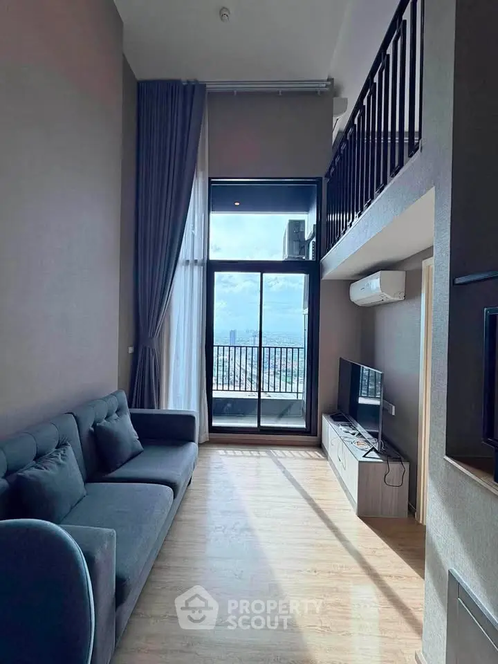 Modern living room with high ceiling and balcony view in stylish apartment