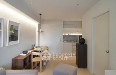 Modern living room with dining area and compact kitchen in open layout