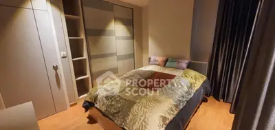 Cozy bedroom with modern decor and ample storage space