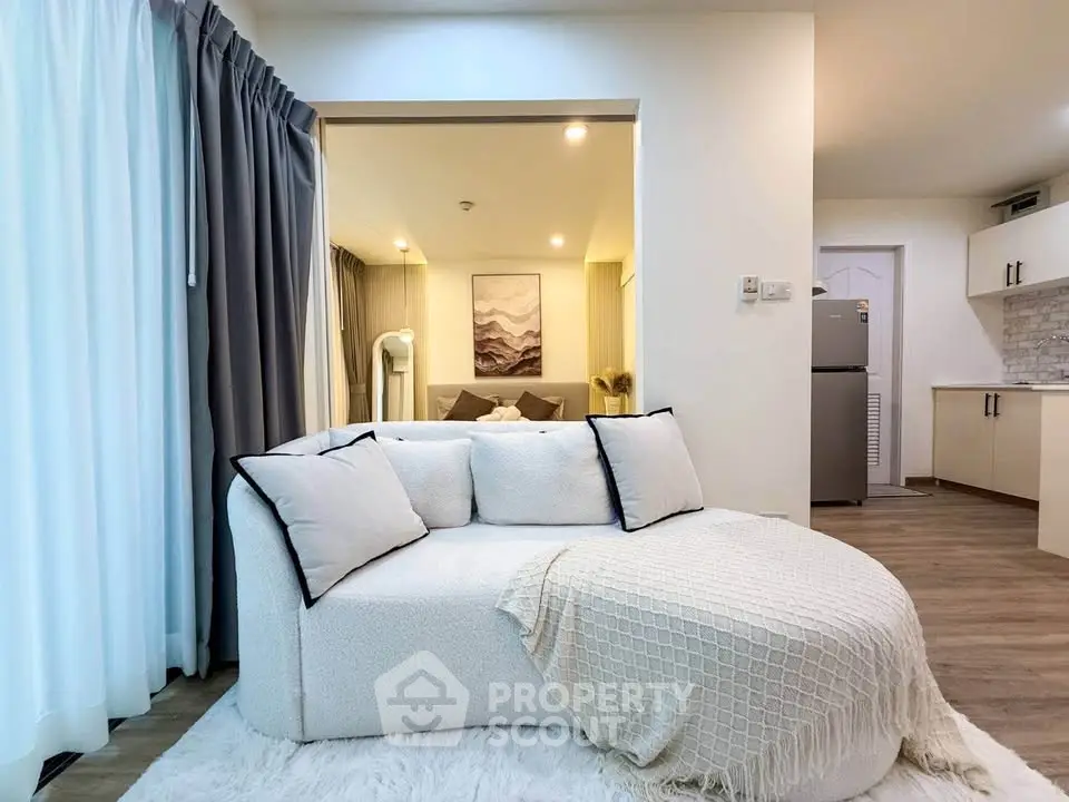 Modern living room with cozy white sofa and elegant decor in a stylish apartment