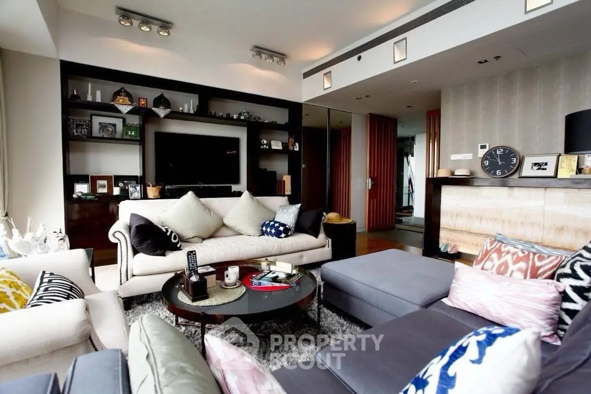 Luxurious modern living room with stylish decor and ample natural light.