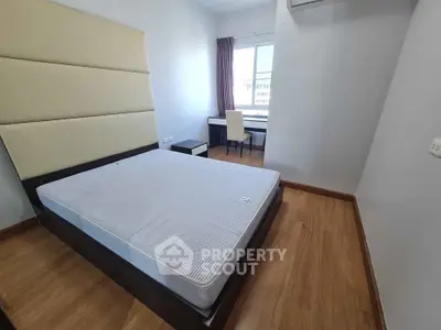 Spacious bedroom with modern design and natural light