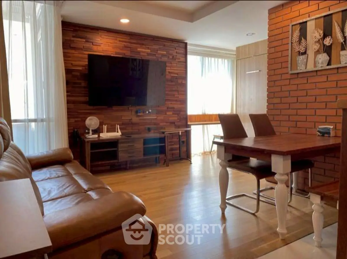 Charming living room with wooden accents and modern furnishings in a cozy apartment.