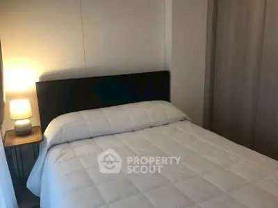 Cozy bedroom with modern decor and soft lighting