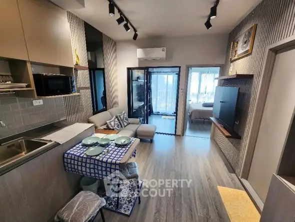 Modern open-plan living room with stylish decor and cozy ambiance