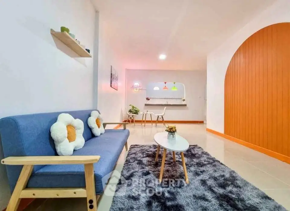 Stylish living room with modern decor and cozy seating area.