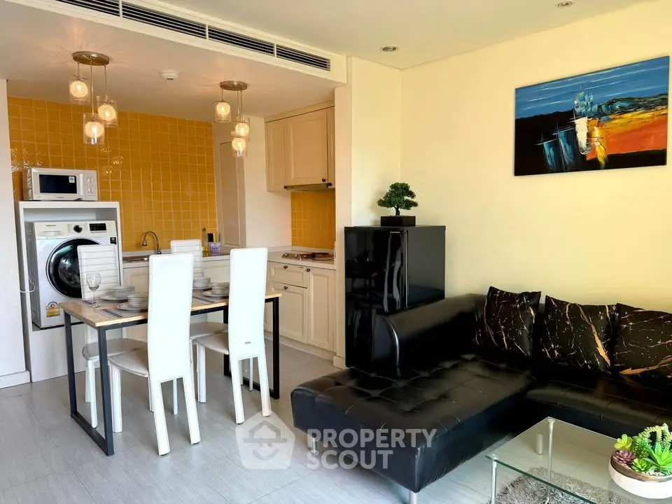 Modern open-plan kitchen and living room with stylish decor and appliances