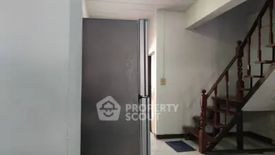Spacious interior with staircase and modern design elements, ideal for residential or commercial use.