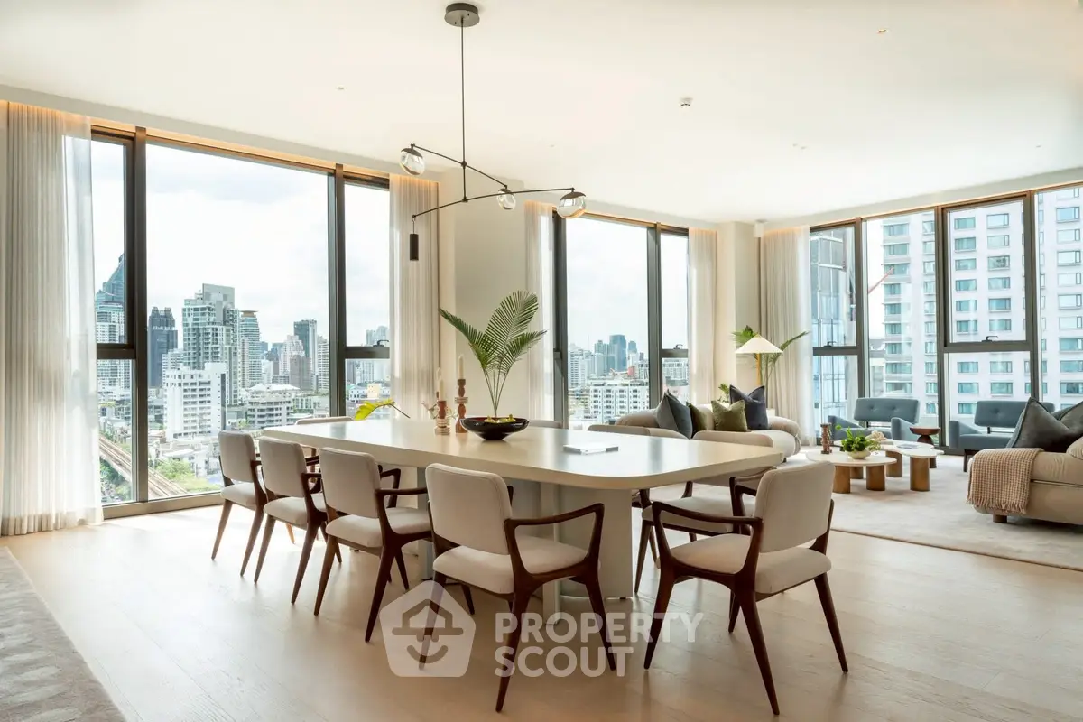 Luxurious modern living room with panoramic city views and elegant dining area.