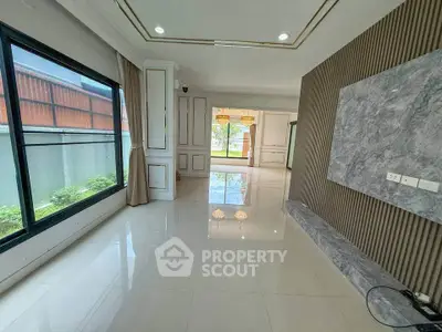 Spacious modern living room with large windows and elegant design