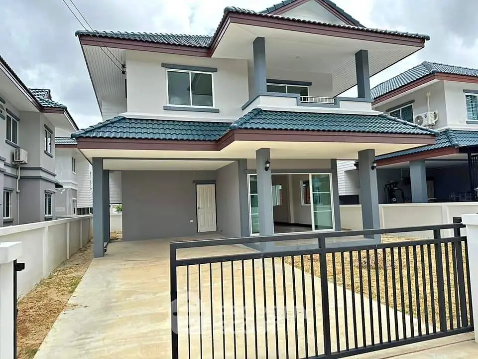 Modern two-story house with spacious driveway and stylish exterior design