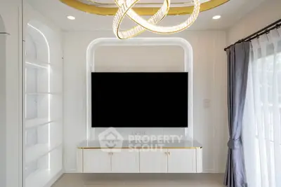 Modern living room with elegant lighting and built-in TV unit