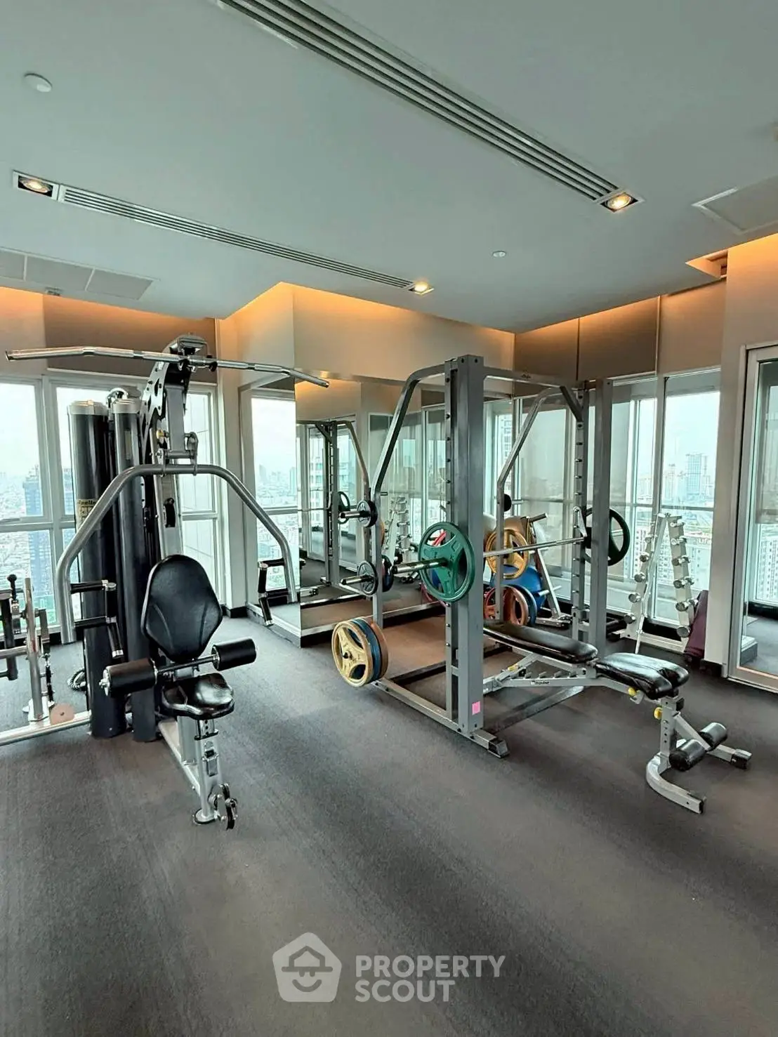 Modern gym with city view and state-of-the-art equipment