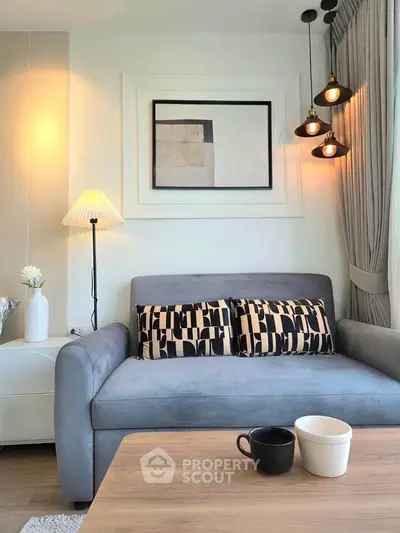 Stylish living room with modern decor, cozy sofa, and elegant lighting, perfect for relaxation and entertaining.
