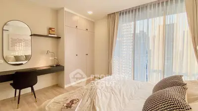 Modern bedroom with city view, featuring stylish decor and ample natural light.