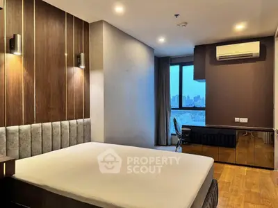 Modern bedroom with city view, featuring sleek design and ambient lighting.