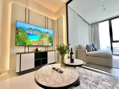 Modern living room with stylish decor and scenic view from window.