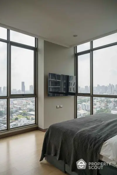 Luxurious bedroom with panoramic city view and modern decor