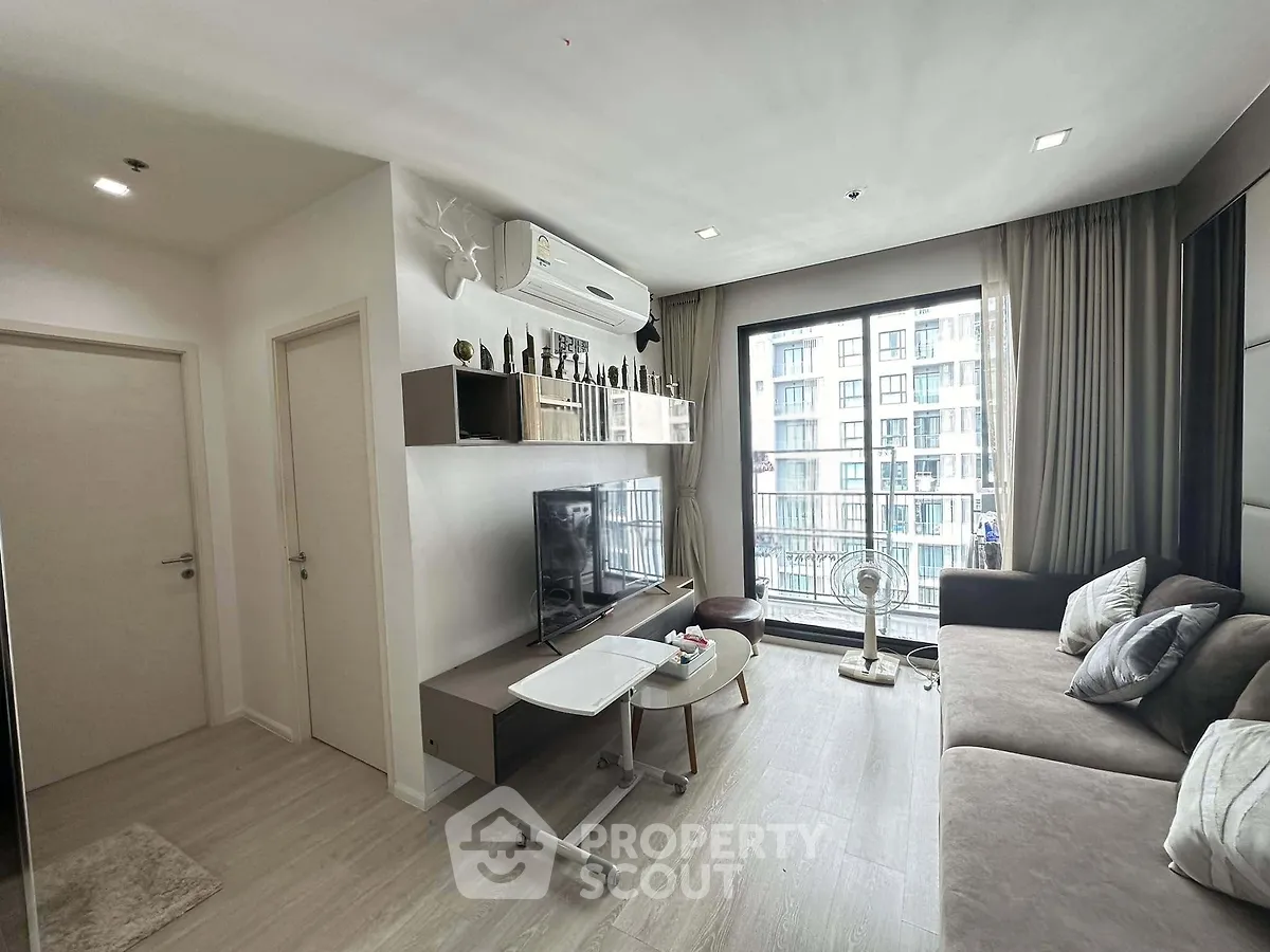 Modern living room with balcony view in stylish apartment