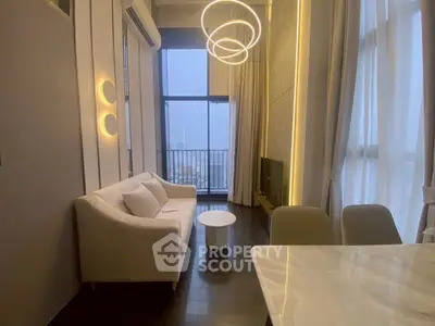 Modern living room with elegant lighting and balcony view