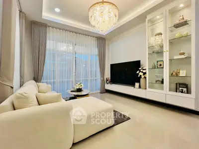 Luxurious living room with elegant chandelier and modern decor