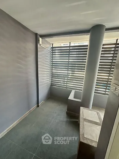 Modern balcony with sleek design and privacy screen