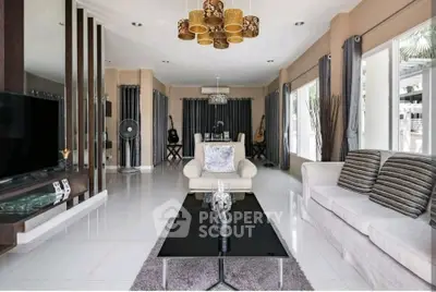 Spacious modern living room with elegant decor and ample natural light.