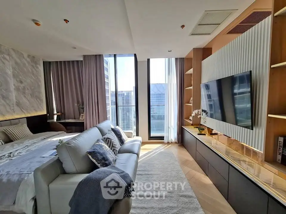 Luxurious modern living room with large windows and elegant decor