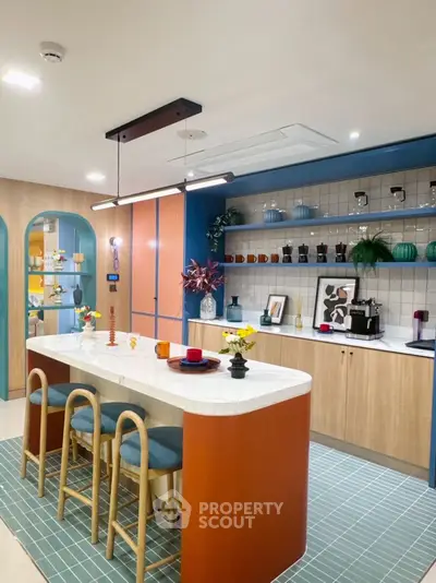 Stylish modern kitchen with open layout and vibrant decor