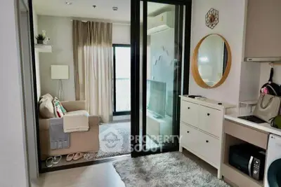 Modern living room with cozy sofa, TV, and balcony view in stylish apartment.