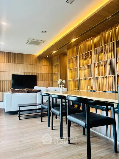 Luxurious modern living room with elegant wooden accents and stylish furniture, perfect for relaxation and entertainment.