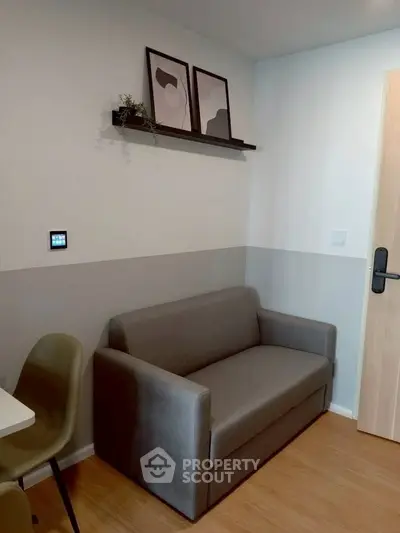 Modern living room with sleek gray sofa and minimalist decor