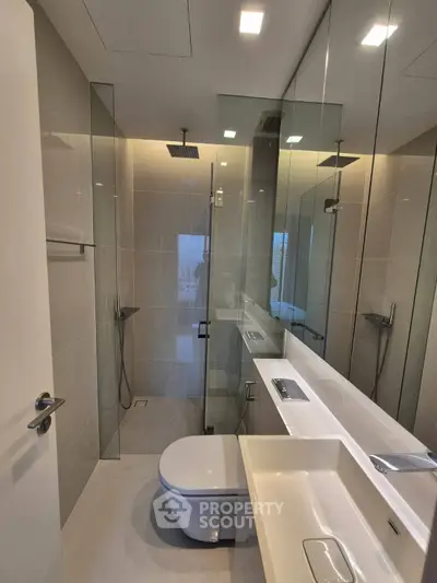 Modern bathroom with sleek glass shower and contemporary fixtures