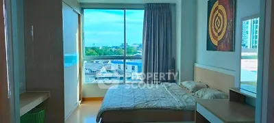 Bright and cozy bedroom with large window and modern decor