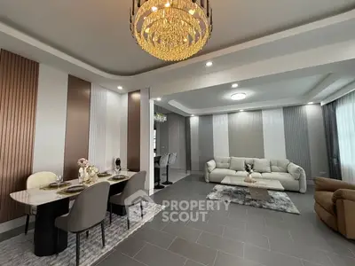 Luxurious modern living room with elegant chandelier and stylish decor