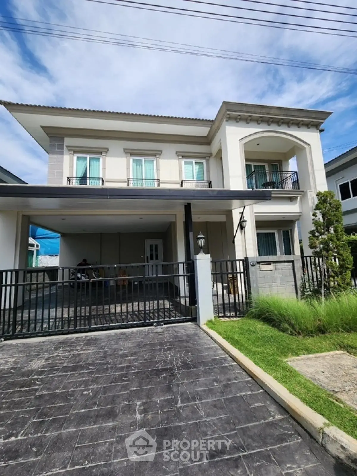 Elegant two-story house with modern design and spacious driveway