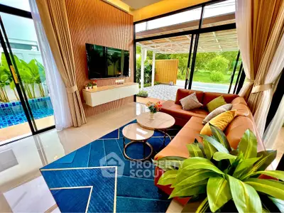 Luxurious living room with pool view, modern decor, and vibrant accents in a contemporary home.