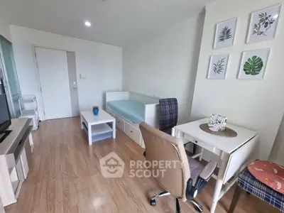 Charming living room with modern decor and natural light, featuring a cozy seating area and stylish furniture.