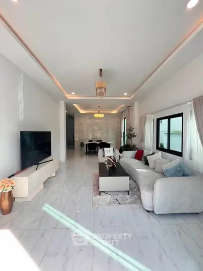 Luxurious modern living room with elegant decor and ample natural light