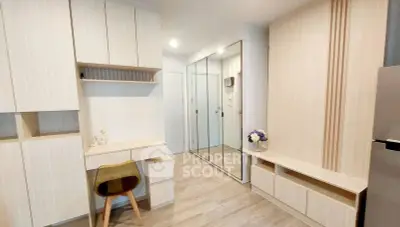 Modern minimalist study room with wooden furniture and mirrored closet doors.