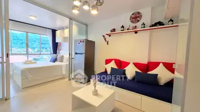 Modern studio apartment with mountain view, featuring cozy living area and stylish bedroom.