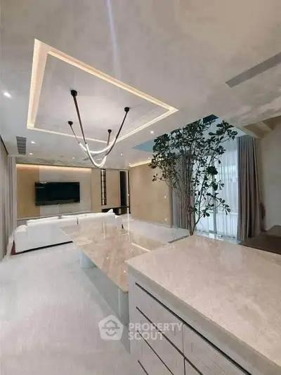 Luxurious modern living room with elegant lighting and spacious design