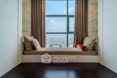 Luxurious window seat with panoramic city view in modern apartment